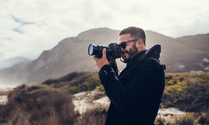 Photographer taking photos outdoors
